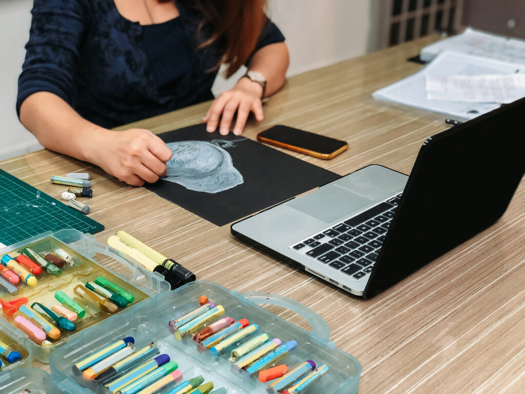 Asian chinese female teacher teaching online class at art school art class